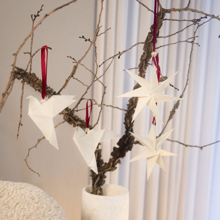 Kerstdecoraties van origami
