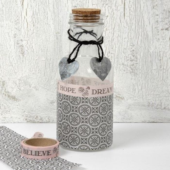 Een gedecoreerde glazen fles met Paris Design papier