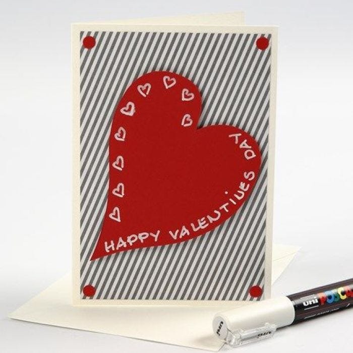 Een Valentijnskaart van design papier met een rood hart