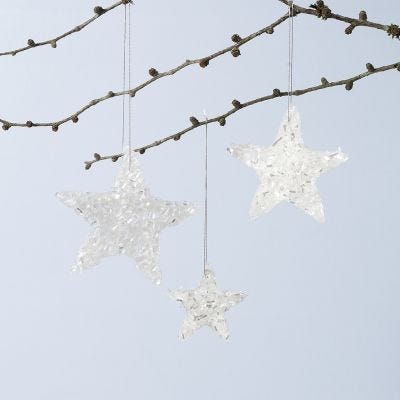 Glanzende ster hangende decoraties gemaakt van Sticky Base en glitter