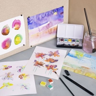 Aquarelbloemen en landschappen