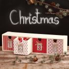 Decoupage op een kleine ladenkast voor Advent cadeaus